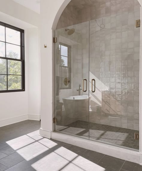 Transitional Ensuite Bathroom, Light Tile Floor Bathroom, Herringbone Bathroom Backsplash, Transitional Half Bathroom, Mallory Ervin House, Organic Modern Master Bath, Modern European Bathroom, Bathroom Stone Tiles, Double Shower Head Master Baths