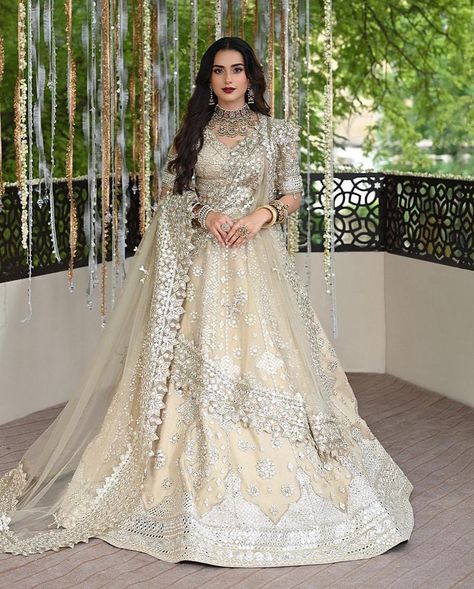 Introducing ‘Roop’—where tradition meets opulence. This stunning lehnga choli ensemble is a celebration of the wedding season, featuring intricate gotta embroidery and handcrafted details that define sophistication. Adorned with delicate laces, exquisite patches, and a rich net dupatta, ‘Roop’ is finished with embroidered tassels and 16 kallis, creating a breathtaking vision from every angle. Embrace the pinnacle of elegance and make your celebration unforgettable with a masterpiece that embo... Iqra Aziz, Raw Silk Fabric, Pakistani Wedding Dress, Lace Accessories, Chiffon Collection, Embroidered Bodice, Embroidered Sleeves, Party Kleidung, Wedding Sale