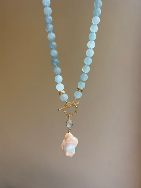 This elegant eye-catching beaded necklace is made of natural aquamarines (AAA quality) and embellished with beautiful baroque pearl pendant settled on an aquamarine charm and gold vermeil toggle clasp. It will become a wonderful gift idea, especially for those who are born in March, as aquamarine is the birthstone for March.  MATERIAL Aquamarine, gold vermeil, freshwater pearl  SPECIFICATIONS Length 46 cm (18 inches) Beads are 8 mm Handmade in Spain Necklace comes in a gift box Worldwide shipmen October Birthstone Necklace, Gold Vermeil Jewelry, Toggle Necklace, Gemstone Necklaces, Aquamarine Jewelry, Vermeil Jewelry, Beaded Choker Necklace, Pearl Charms, Necklaces For Women