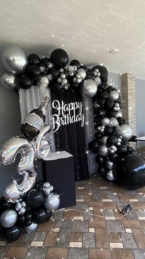 If you have a big party coming up and you’re planning to throw a birthday party for yourself or your men, we have some tips that will help make it a great event. From cool men's birthday themes to romantic mens birthday themes for husbands, we'll help you celebrate in style. Let's take a look at our selected ideas below and get ready to be inspired! Black Silver Birthday Decor, Black And Silver Party Ideas, Black Out Party Theme, Black Table Cloth Decor, Silver And Black Party Decorations, Black And Silver Birthday Decorations, 18th Birthday Decorations For Boys, Black Themed Birthday Party, Black And Silver Balloons