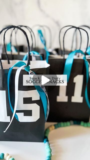 Sierra Miller | Content Creator on Instagram: "I’m on snack mom duty this weekend so you know I had to go all out! ⚽️🙈   I found these bags @hobbylobby and put each team member’s jersey # on the front. I cut the numbers with my @cricut but you could also use stickers for this part if you don’t have a cricut. To bring it all together, I added some coordinating ribbon, which really completed the look! Then, I filled it with some goodies to enjoy after the game. 😍 Being a mom is so much fun..🥹 . . . . . #soccerlife #soccermom #snackmom #soccersnacks #soccersnackideas #kidssoccer #giftideas #soccerparty #soccerpartyideas" Diy Soccer Treat Bags, Senior Night Treat Bags, Last Soccer Game Treats, Football Mom Snack Ideas, Team Mom Soccer, Sports Snack Ideas Team Mom, Soccer Bags For Snacks, Football Game Treats For Players, Football Team Treats Goodie Bags