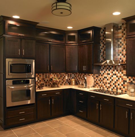 Get an original kitchen with dark wood cabinets, interior tiled walls and unique lighting from Craftsmen Home Inc. Dark Brown Kitchen Cabinets, Brown Kitchen Ideas, Dark Brown Kitchen, Espresso Kitchen Cabinets, Dark Brown Cabinets, Espresso Kitchen, Brown Kitchen Cabinets, Beautiful Kitchen Cabinets, Kabinet Dapur