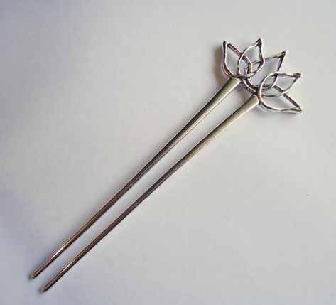 This decorative Silver Lotus Flower is approximately 1 7/8" Wide and 1" Tall.  It sits upon parallel hair sticks that are approximately 4.75" Long.  The total length is 5.75" Long.  The open lotus flower design lends itself to easily add dangles or embellishments of your choice!This listing is for ONE hair stick. Hair Stick Design, Open Lotus Flower, Japanese Hair Stick, Asian Hair Accessories, Clothing Pattern Design, Chopstick Hair, Lotus Flower Design, Hair Fork, Japanese Hairstyle