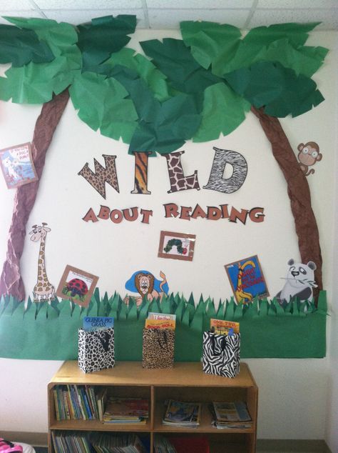 Preschool reading area. Jungle Theme Library Classroom Ideas, Safari Reading Corner, Jungle Reading Corner, Jungle Infant Classroom, School Book Corner, Library Door Decorations, Rainforest Theme Classroom, Preschool Reading Area, Storybook Classroom