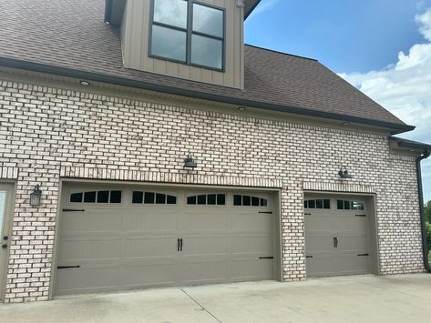 E-Z Lift Garage Doors | These @chioverheaddoors Model 5951 Long Stamped Carriage doors with arched Madison windows in Sandstone looked perfect on this new custom… | Instagram 2 Car Garage Door, Garage Door With Windows, Car Garage Door, White Garage Doors, Double Garage Door, White Garage, Carriage Garage Doors, Garage Entrance, Carriage Doors