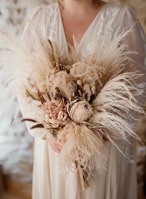 A huge statement bouquet full of fluffy pampas and exotic dried flowers. We used a warm neutral colour palette and kept the look very natural. To see more dried wedding flower inspo please visit my website. Designed and created by @bryonymaeflowers Photography @juliehermannphotography Bouquet With Dried Flowers, Flower Bride Bouquet, Dried Flower Wedding, Flower Bride, Flower Boquet, Grass Bouquet, Pampas Grass Bouquet, Boho Wedding Bouquet, Wedding Bridal Bouquets