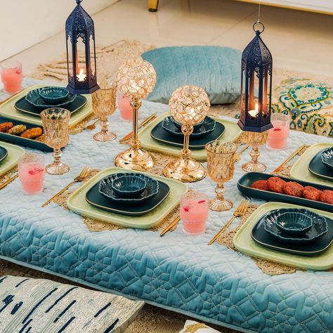 Shop the look for a feast-ive celebration! 😍🍽️ Add a touch of magic to your moments of togetherness with our exquisite range. 🪄✨ Products included: 1. Luxe Moroccan 28-Piece Ceramic Dinnerware For 6 Dark Green 2. Set Of 6 Floral Drinking Glass Tumblers 3. Luxurious Crystal Votive Candle Holder Stand Set Of 2 4. Navy Blue Moroccan Candle Holder Lantern Set Of 2 5. Quilted Aqua Blue Table Cover With Silver Threadwork 6. Sage Green Textured 27-Piece Dinner Set For 6 7. Gold Star Shaped Dining... Moroccan Table Setting, Moroccan Candle Holder, Arabian Nights Party, Candle Holder Lantern, 27 Piece, Eid Mubarak Gift, Standing Candle Holders, Eid Decoration, Lantern Set