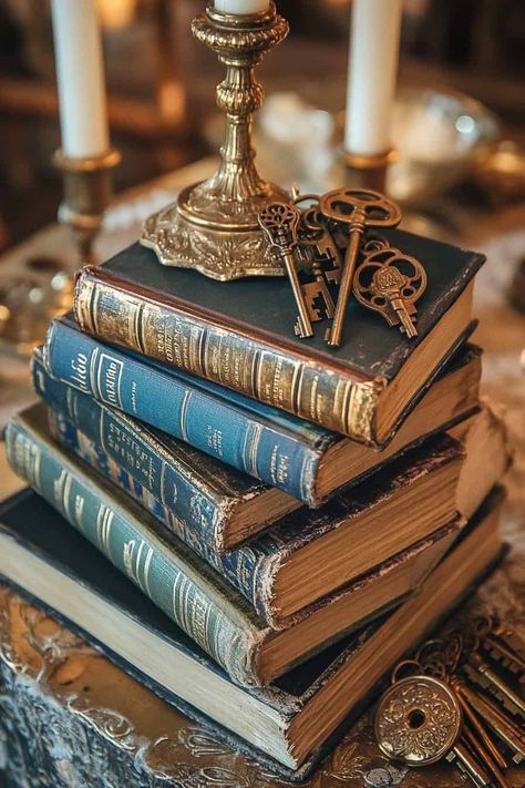 Book Decor Wedding Centerpieces, Wedding Table Numbers Books, Old Books Wedding Decor, Dark Academia Centerpiece, Vintage Book Themed Party, Victorian Wedding Centerpieces, Book Lover Wedding Ideas, Historical Wedding Theme, Homecoming Centerpieces