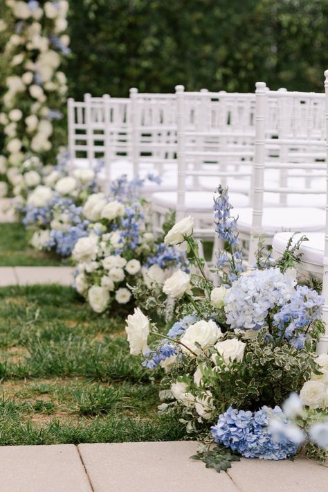 Kati & Bryant’s elegant blue white wedding ceremony décor included elegant white and blue hydrangea wedding aisle flowers and dusty blue wedding florals. Based in Nashville, we offer luxury destination weddings worldwide. Blue and white wedding theme, Nashville wedding venue, elegant wedding ceremony décor, dusty blue wedding color palette, luxury weddings Garden Wedding Blue Theme, Wedding Floral Arrangements Blue, Wedding Floral Aisle Arrangements, Dusty Blue Wedding Aisle, Wedding Isles Outdoor Elegant, Blue Monochromatic Wedding, Dusty Blue Flower Arch, Wedding Ceremony Flower Ideas, Blue White Centerpieces