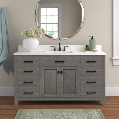 This clean-lined single-bathroom vanity set maximizes the storage in your space. Its wide 60" design is made from engineered wood with a rustic finish, and its surface is crafted with your choice of material and hue. The included white undermount sink is made from ceramic, and it boasts a rectangular silhouette. This vanity has six dovetailed drawers with sleek black metal pulls, and they open to reveal space for washcloths, toothpaste, and hair ties. And the two cabinet doors hide extra shelf s 60 Inch Vanity Single Sink, 49 Inch Bathroom Vanity, Bathroom Vanity Gray, 60 Inch Single Sink Bathroom Vanity, Bathroom With Gray Vanity, Bathroom Single Vanity, Gray Vanity Bathroom, Bathroom Vanity 60", 60 Inch Vanity One Sink