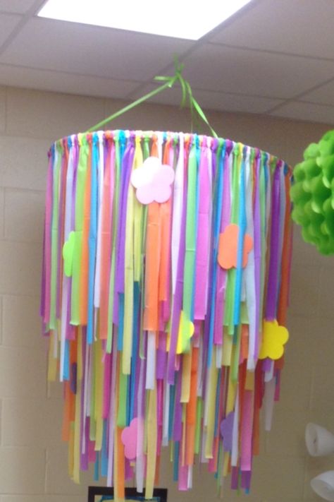 Ribbon Chandelier made from 2 different sized hoola hoops, strips of plastic tablecloths and flowers all from Walmart and The Dollar Tree. I came up with this inexpensive idea for my classroom. This kids LOVE IT! Daycare Room Ideas, Ribbon Chandelier, Daycare Rooms, Hoop Frame, Diy Baby Mobile, Summer Diy Projects, Class Theme, Plastic Tablecloth, Rainbow Theme