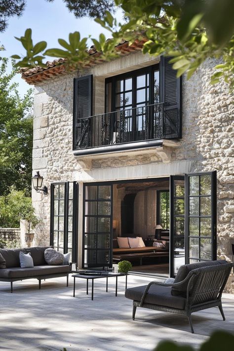 Modern French country house terrace with French doors. Check out all of these charming and sophisticated modern French country houses with their captivating exterior. Country House Terrace, French Doors Garage, French Village House, Modern French Country House Exterior, Modern Mediterranean House Design, French Terrace, French Country House Interior, Modern Farmhouse Architecture, French Facade