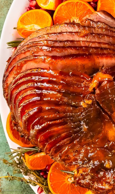 Salty-sweet, deliciously sticky, and perfect for any holiday table, this Maple Orange Glazed Ham recipe is sure to become a family tradition. Simply made with just 15 minutes of active kitchen time and a pre-cooked spiral ham, this no-cook orange ham glaze will enable you to sit back, relax, and enjoy the party — while still knocking everyone’s socks off. Apricot Glazed Ham, Cooking Ham In Crockpot, Cooking Spiral Ham, Christmas Crockpot Recipes, Orange Glazed Ham, Thanksgiving Main Dishes, Honey Mustard Glaze, Ham Glaze Recipe, Crockpot Ham