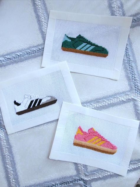 Sambas are the it shoes right now and these cute sneaker needlepoint canvases match the hype! Each samba needlepoint is painted on 18 mesh Mono Deluxe Zweigart. These cute canvases would the perfect for bag embellishments/tags, scissor fobs, or a trendy ornament.  Each canvas is hand-painted and custom options are available. Please message me or DM me @goldiemaeneedlepoint about a custom color combination to match your school, favorite team, or your own pair at home. Otherwise selected colorways are available and more are coming soon if you don't see your favorite just yet! Needlepoint Keychain, Needlepoint Bag, Needlepoint Monogram, Funny Needlepoint, Branding Aesthetic, Miniature Needlepoint, Scissor Fobs, Needlepoint Finishing, Needlepoint Projects