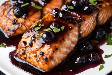 Introduction Blueberry Glazed Salmon is a delicious and unique way to bring vibrant, fruity flavors to a savory dish. This recipe features perfectly seared salmon fillets paired with a tangy-sweet ... Learn more Blueberry Salmon Recipes, Salmon With Blueberry Sauce, Blueberry Recipes Savory, Blueberry Salmon, Bourbon Glazed Salmon, Blueberry Wine, Salmon Curry, Sauce For Salmon, Foo Foo