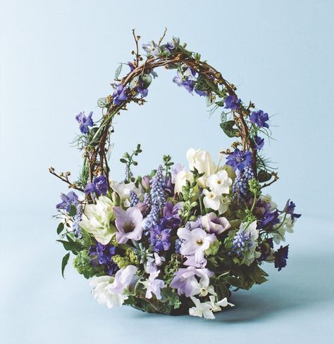 Beautiful, functional, handmade, and constructed primarily of natural materials, baskets are the perfect container to hold the bounty of your imagination Blue Spring Flowers, Flower Magazine, Basket Flower Arrangements, Easter Flower Arrangements, Easter Arrangement, Spring Flower Arrangements, Spring Basket, Spring Arrangements, Spring Floral Arrangements