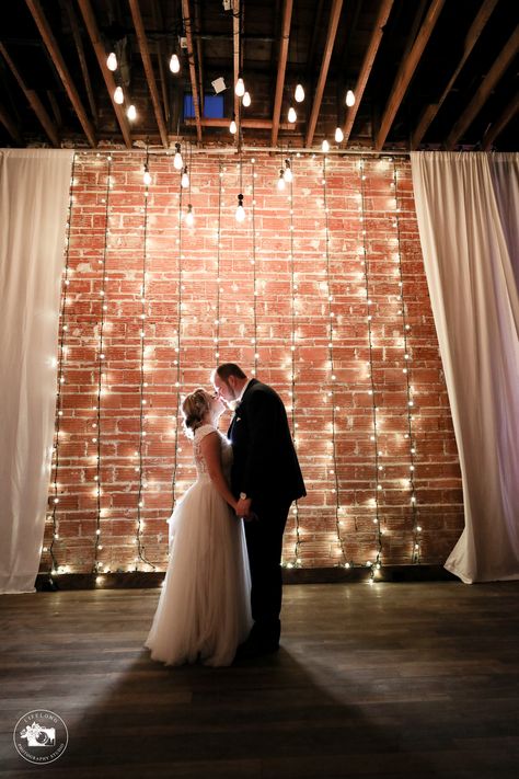 Wall Drapes, Gala Decorations, Brick Wall Backdrop, Hanging String Lights, Photo Backdrop Wedding, Green Themed Wedding, String Lights Wedding, Brick Wall Background, Wedding Wall