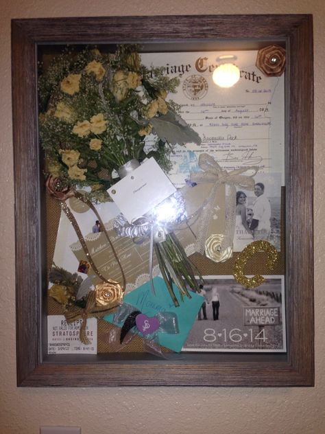 DIY post wedding shadow box. Great way to display & keep special memories/items safe and preserved. Las Vegas Stratosphere ticket-where Bubs proposed to me, STD, post stamp sized engagement picture calendar STD savers, invitation, envelop sticker, rehearsal floral headband, wedding bouquet/boutineer, garter, letter to Momma/momma's special memorable decal from Cake Topper, I love you more message from MOH, marriage certificate, Thank You card. ||Clemens Wedding|| Marriage Certificate Display, Las Vegas Stratosphere, Wedding Picture Walls, Picture Calendar, Wedding Cards Keepsake, Picture Display Wall, Floral Headband Wedding, Wedding License, Wedding Invitations With Pictures