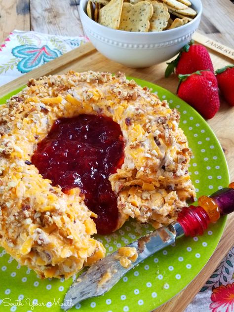 Pecan Cheddar Cheese Ring with Strawberry Preserves | Rosalynn Carter’s vintage appetizer recipe for a pecan and cheddar cheese ring with a slight hint of heat with strawberry preserves in the center served with crackers. Plains Georgia Cheese Ring, Roselyn Carter Cheese Ring, Rosalyn Carter Cheese Ring, Plains Special Cheese Ring, Pecan Cheddar Cheese Ring, Bacon Cheese Ring With Jam, Cheese Ring With Pepper Jelly, Cheese Ring With Strawberry Jam, Pepper Jelly Cheese Ball