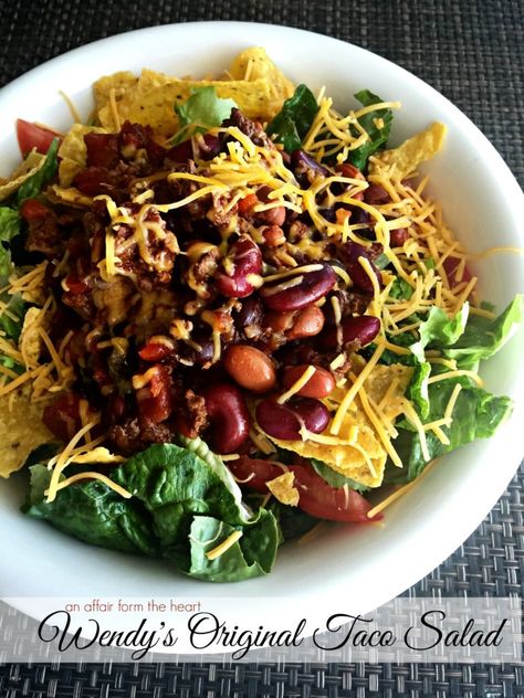 Wendy's Original Taco Salad, with their famous chili over lettuce, tortilla chips, tomatoes and cheese. Wendys Taco Salad, Taco Salad Bowls, Tortilla Bowls, Lentil Tacos, Cinnamon Honey Butter, Taco Salads, Taco Salad Recipes, Tomato And Cheese, Homemade Tacos