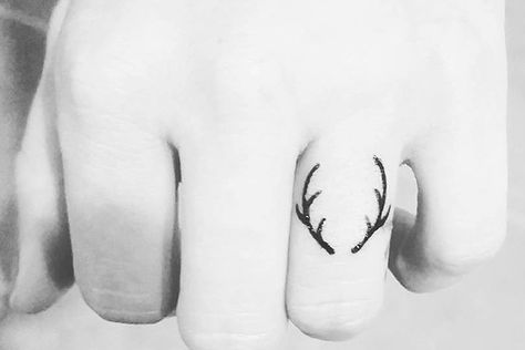 50 Of The Tiniest, Most Tasteful Tattoos Ever Tiniest Tattoos, Hanger Tattoo, Wedding Ring Tattoos, Antler Tattoos, Wedding Rings Ideas, Antler Tattoo, Finger Tattoo For Women, Deer Tattoo, Handpoke Tattoo