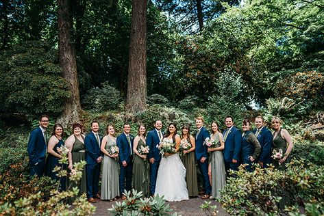 Blue groomsman suits.  I like paired with the olive green bridesmaids dresses #crystalspringsrhododendrongarden #portlandparkwedding #portlandweddingvenue #oregonbride #portlandweddingphotographer #portlandweddingvenues #portlandoregon #gardenwedding #outdoorwedding #parkwedding #urbanwedding #olivegreendresses #navysuits Navy Blue Suit And Sage Green Dress, Navy Blue And Moss Green Wedding, Olive Green Bridesmaid Dress Navy Suit, Green Dresses Blue Suits, Navy Groomsmen Suits And Green Bridesmaids, Blue Groomsmen Suits And Green Bridesmaids, Green Groom Suit Blue Groomsmen, Blue Suit Green Dress Wedding, Olive And Navy Blue Wedding