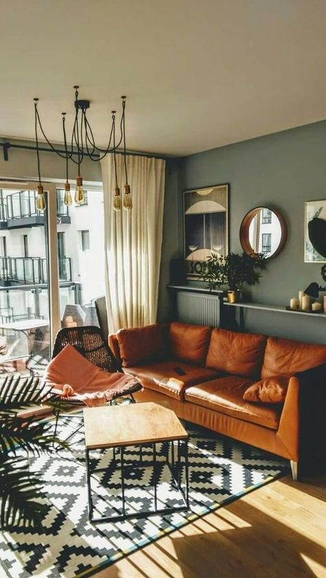 This large, brown leather couch draws attention first. Looking at it I notice the rug and its more intricate design as well as the shadows of the desk and how they look on the floor. Living Room Color Combination, Room Color Combination, Living Room Inspo, New Living Room, A Living Room, Apartment Living Room, Johannesburg, Design Living, Room Colors