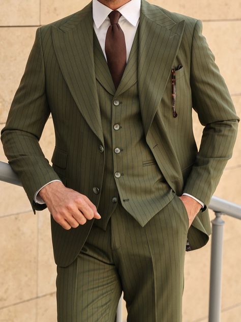 Shine in the spotlight with this magnificent khaki slim-fit 3-piece suit, featuring a sleek ticket pocket on the jacket and grand peak lapels on both the jacket and vest, exhibiting timeless elegance and historical prestige. Color: khaki striped Material: 70% wool, 27% polyester, 3% elastane Suit includes blazer, waistcoat, & trousers Single-breasted suit (2-button blazer) Lapel type: peak lapels Jacket interior lining option: fully-lined Jacket vent: double vent Fitting: slim-fit Care instructi Brown Suit Wedding, Blazer Waistcoat, Olive Green Suit, Prom Men, Suit Stores, Slim Fit Suit Men, Formal Men, Slim Fit Tuxedo, Lapel Jacket