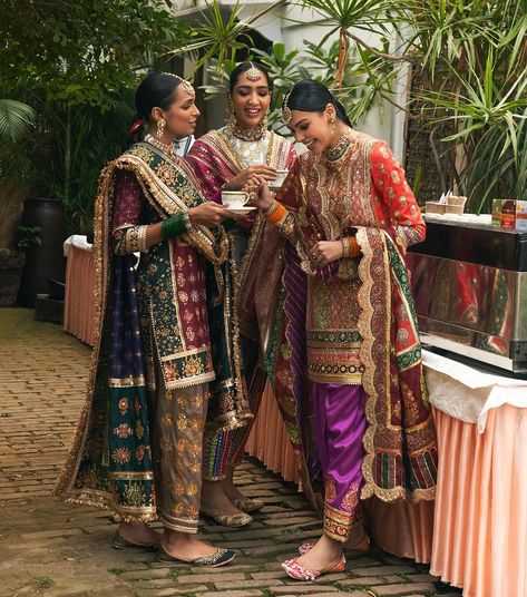 Mayyur Girotra Official | ‘Lohri’ by Mayyur Girotra • As the family comes together, everyone is engaged in fun and banter. The women are dressed in Chanderi silk… | Instagram Punjabi Wedding Outfits Sisters, Luxury Festive Jamawar Traditional Wear, Luxury Traditional Suits For Diwali, Punjabi Wedding Family Outfits, Shaddi Outfit For Sister, Lohri Outfits For Women, Wedding Suit Women, Designer Suits For Wedding, Meeting Outfit