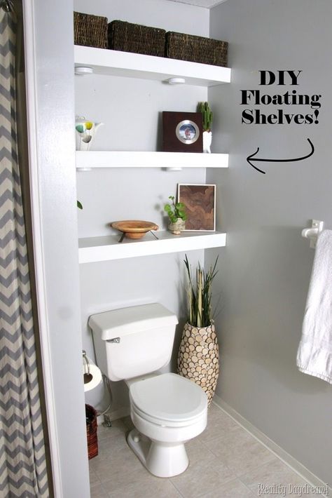 DIY Floating Shelves in Bathroom above toilet {Reality Daydream} Above Toilet, Diy Floating Shelves, Shelves Above Toilet, Shelves Over Toilet, Bathroom Shelves Over Toilet, Floating Shelf Decor, Bathroom Shelf Decor, Toilet Shelves, White Floating Shelves