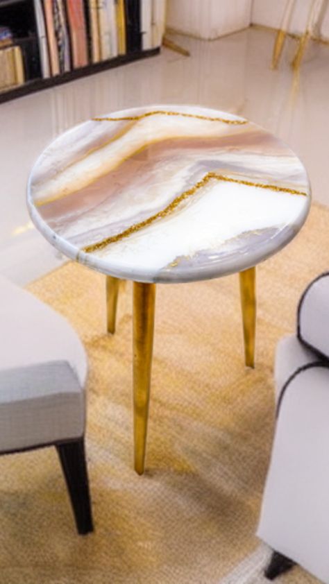 Our resin tables feature a beautiful blend of natural stone and glossy epoxy resin, creating a one-of-a-kind piece that will be the centerpiece of any room. The geode art and geode tables are inspired by the natural beauty of crystals and minerals, with intricate details that mimic the mesmerizing patterns found in nature. Our entry tables are perfect for adding a touch of elegance to your foyer or hallway that will attract your guests. Coffee Table Epoxy, Table Redo, Resin Tables, Resin Coffee Table, Coffee Table Round, Table Epoxy, Geode Art, Entry Tables, Epoxy Resin Table