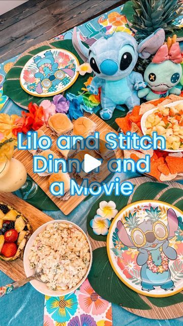 Heather Tenneson on Instagram: "Happy Stitch Day! Last week we celebrated Experiment 626 with a Lilo and Stitch Dinner and a Movie night with some good friends. We both have Stitch obsessed girlies, so we were thrilled to have them come and join in on the fun. 💙  On the menu: - Ohana Pinapple Salsa and Chips - Stitch’s Luau Pulled Pork Sliders - Experiment 626 Macaroni Salad - Island Roller Coaster Ride Pina Colada Cupcakes - Dole Whip Floats and Pina Colada Mocktails  This is the first movie night we’ve done from @thefairytalefoodie’s newest Dinner and a Movie cookbook and she absolutely nailed the island flavors. Every single dish was packed full of flavors straight from Hawaii. It was a culinary experience and a fun time fellowshipping with friends 🩵❤️🤍   #disneydinnerandamovie #disn Stitch Charcuterie Board, Lilo And Stitch Menu Ideas, Lilo And Stitch Sleepover, Stitch Food For Party, Lilo And Stitch Dinner And A Movie, Stitch Party Food Ideas, Lilo And Stitch Dessert Table, Stitch Birthday Food Ideas, Lilo And Stitch Desserts