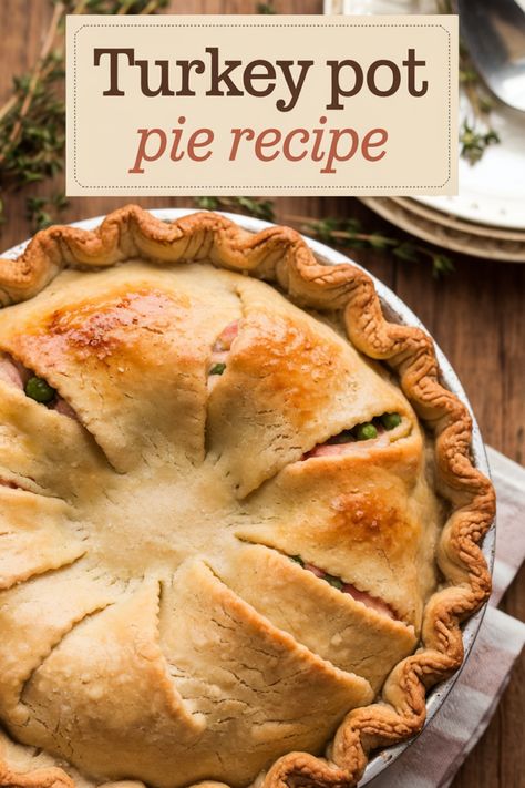 Turkey pot pie with a golden, flaky crust, surrounded by plates and silverware. Turkey Potpie, Potpie Recipe, Turkey Pot Pie Easy, Pot Pie Recipe Easy, Turkey Pot Pie Recipe, Turkey Pie, Turkey Pot, Pot Pie Recipe, Turkey Pot Pie