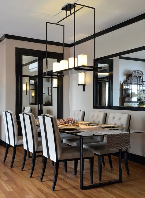 Beige walls with streamlined lacquered black trim. Gloss black dining table & leather dining chairs with backrest detail. The rectangle frame pendant with candles make an elegant focal point. | Design Intervention. Singapore Penthouse.  #tuftedchair #japaneseinspired #asianinspired # eastmeetswest #traychandelier #blacklacquer Beige Wall Black Trim, Black Trim Tan Walls, Black Trim Dining Room, Black Moldings And Trim Living Room, Beige Walls Black Trim, Cream Walls Black Trim, Black And Beige Dining Room, Beige And Black Dining Room, White Walls Black Trim Living Room