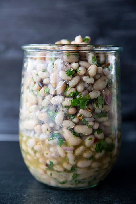 Full of fresh herb flavors, White Bean Salad comes together in a breeze. Made with canned or home cooked white beans, abundant fresh herbs, and a simple vinaigrette dressing, this salad is delicious as a light lunch on its own or as a side dish with all your favorite entrees. White Bean Recipes, White Bean Salad, Simple Vinaigrette, Bean Salad Recipes, One Pot Dinners, Vinaigrette Dressing, Light Lunch, White Bean, Mediterranean Diet Recipes