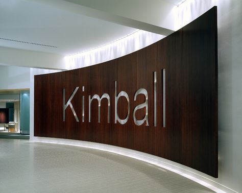 Kimball International - curved wood signage wall Lobby Logo Wall, Office Logo Wall Design, Wall Signage Design, Office Logo Wall, Logo Wall Design, Logo On Wall, Large Signage, Education Design Interior, Corporate Signs