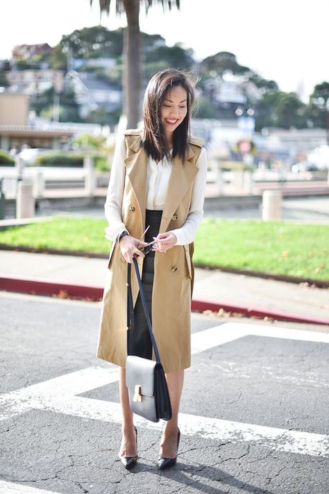 I can’t help but fall back on this simple recipe all too often: a white blouse (an essential), a pencil skirt (in this case, in leather or faux leather to add a little interest) and a trench coat (cool details on this one made it hard to resist). I enjoyed a quick little getaway to … Trench Vest Outfit, Sleeveless Coat Outfit, Sleeveless Trench Coat, Trench Vest, Sleeveless Trench, Trench Coat Outfit, Sleeveless Coat, Sleeveless Blazer, Trench Dress