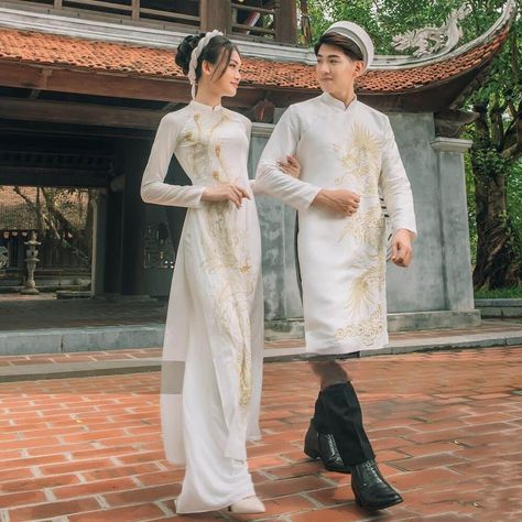 👉 7 DAY REFUND SUPPORT FOR CUSTOMERS IN VIETNAM * Still a Vietnamese girl walking down the street, how beautiful are her innovative ao dai. Selected from the best materials, the 4-piece modern ao dai will bring her the perfect experience. * With a delicate ao dai design in the flower-embroidered sleeves, a little bit of momentum with a stylized side part, this innovative ao dai can turn any girl into a beautiful lady. , young, lovely. * Ao dai in different colors such as pink and beige helps he White And Gold Ao Dai, Ao Dai Couple, Ao Dai Design, Vietnamese Wedding Ao Dai, Vietnamese Wedding Dress, Modern Ao Dai, Vietnamese Girl, Bridal Suits, Vietnamese Wedding