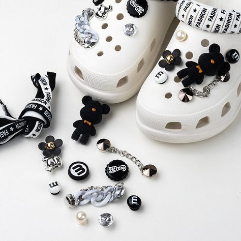 Customizable luxury accessories for Crocs-style shoes, featuring premium materials like ABS, acrylic, and alloy. Each set includes detachable charms and chains, perfect for adding a personal touch to your footwear. Available in various themes and designs to suit every taste.... https://www.shopcrossway.com/product/black-white-lace-violent-bear-charm-set/ Charm Set, Luxury Accessories, Personal Touch, White Lace, Fashion Shoes, Charms, Black White, Black And White, Chain