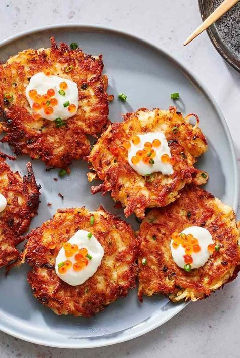 Our best latke recipes include classic crispy potato pancakes and inventive sweet potato latkes. Plus more Food & Wine latkes and garnishes for Hanukkah and beyond. Best Latkes Recipe, Latkes Recipe Traditional, Latkes Recipe, Potato Latkes Easy, Crispy Potato Pancakes, Sweet Potato Latkes, Potato Latke Recipe, Potato Latkes, Grilled Potatoes