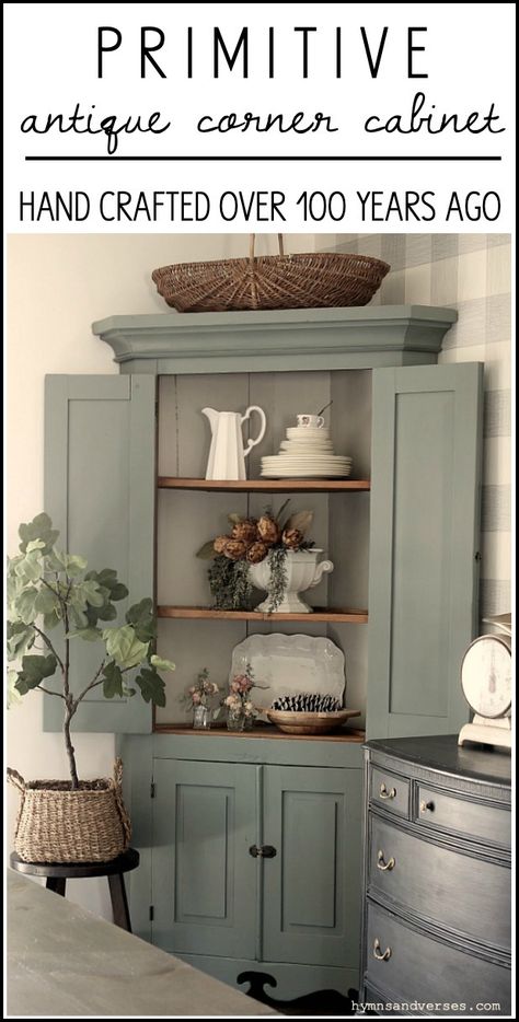 This primitive corner cabinet has been in my family for generations and is over 100 years old! I recently painted it and love how it turned out. #hymnsandverses #antiquecabinet #antiquecornercabinet #paintedcabinet #greencabinet #greenpaint #shadesofgreenpaint #paintingfurniture #furniturepainting #paintedfurniture #primitivefurniture Paint Corner Cabinet, Corner Hutch Cabinets, How To Decorate A Corner Cabinet, Corner Dining Cabinet, Corner Cabinet Redo Ideas, Corner Cabinet Repurpose, Corner Cabinet Decor Ideas, Styling A Corner Cabinet, Corner Cabinet Paint Ideas