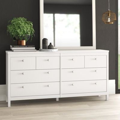 This 8-drawer double dresser enhances your space with its extensive storage capacity. It has an engineered wood frame with a white finish for a crisp, clean look we love. Eight drawers provide a place for everything from sweaters and denim to linens and blankets. They're accented with hardware of your choice depending on your bedroom's style and color scheme. At over 62" wide, there's ample room on top to keep valet or jewelry boxes and various decor. A wall anchor is included for extra stabilit Wide White Dresser, White Dressers Bedroom, Long White Dresser, White Dresser Decor, White Bedroom Dresser, Dresser Long, Bedroom Dresser Styling, White Dresser Bedroom, Natural Wood Dresser