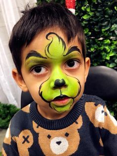 Face Paint Grinch, Kids Christmas Makeup, Boys Christmas Face Paint, Easy Face Painting Ideas For Kids Christmas, Winter Face Paint Ideas, Grinch Face Makeup, Christmas Face Painting Easy Cheek Art, Face Painting Christmas Easy, Christmas Facepainting Ideas