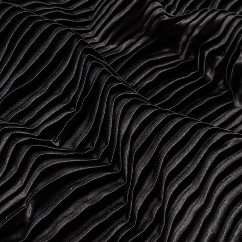 There's nothing shady about this Black Pleated Stretch Satin! Sporting a smooth and soft face, a modestly structured drape, and a fun accordion pleated design with a fair amount of stretch along the weft, it's ideal for A-line skirts, maxi skirts, empire dresses and more! Opaque in nature, a lining isn't needed but may be used in instances where additional structure is desired.  Please be aware that this collection of pleated fabrics is measured and cut with an open pleat. Brand Exploration, Mood Designer Fabrics, Pleated Fashion, Garment Sewing, Soft Face, Black Drapes, Duchess Satin, Mood Fabrics, Color Palette Design