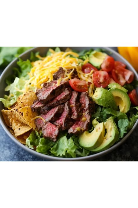 Ready to fill your dinner plans with something delicious? This tasty Steak Taco Salad Recipe is just what you need! Perfectly seasoned steak served on a bed of fresh lettuce and vibrant toppings like tomatoes, avocados, and shredded cheese. It's a delightful and colorful way to enjoy your favorite taco flavors in a salad form. With this healthy twist, you’ll satisfy cravings while staying on track. Ideal for family dinners or meal prep, this recipe ensures you eat well without sacrificing flavor! Get ready to impress your guests! Mexican Steak Salad, Steak Taco Salad, Steak Fajita Salad, Seasoned Steak, Salad Taco, Steak Taco, Keto Steak, Mexican Steak, Creamy Avocado Dressing