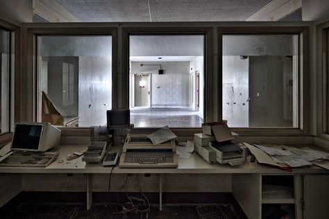 https://flic.kr/p/bdS1eR | observation | The view from a dormant nurse's station. With 80's and 90's era office equipment in place. Military Bases, Old Hospital, Mental Asylum, Nurses Station, Abandoned Asylums, Spaceship Interior, Nurse Office, Chaos Theory, Mental Hospital