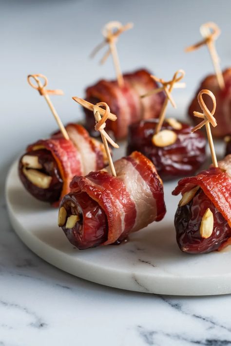 A photo of a  Bacon-Wrapped Dates a christmas appetizer recipes Bacon Fig Appetizer, Bacon Wrapped Figs, Fig Appetizer, Best Christmas Appetizers, Christmas Appetizers Easy, Bacon Wrapped Dates, Easy To Make Appetizers, Christmas Recipes Appetizers, Christmas Appetizers