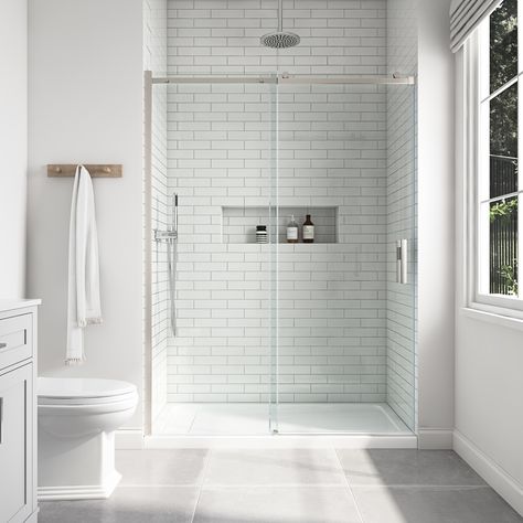 The minimalist design of the Davidson sliding shower door combines a beautiful frameless construction with a smooth streamlined rolling system, making it a must-have feature for any bathroom upgrade. It opens and closes with a sliding movement, aided by an aluminum top bar, 1-1/2-in diameter rollers, and double-sided door handles. It includes 1/4-in (6mm) thick tempered clear glass panels for added reinforcement. The double-sided, easy-clean, shower door is available in widths of 48-in and 60-in Chrome Shower Door, Chrome Towel Bar, Frameless Sliding Shower Doors, Allen Roth, Double Sink Bathroom, Shower Surround, Double Sink Bathroom Vanity, Sliding Shower Door, Bathroom Redo