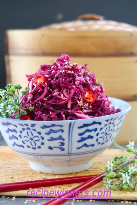 Chinese pickled red cabbage with Ginger is really crunchy, with a zingy sweet and sour flavour, strewn with flecks of red chilli and matchsticks of fresh ginger. It's a winner! We love to serve this with crispy, sweet pork belly slices on bao buns smeared with hoisin sauce. Pickled cabbage cuts through the richness of pork, and makes a perfect accompaniment to duck or rich salmon.  Delish! #chinese #chinesefood #foodporn #redcabbage #ginger #salad #pickled Picked Onions, Vegan Tapas, Asian Salads, Pickled Red Cabbage, Red Cabbage Recipes, Pork Belly Slices, Sweet Pork, Salsa Recipes, Chinese Recipe