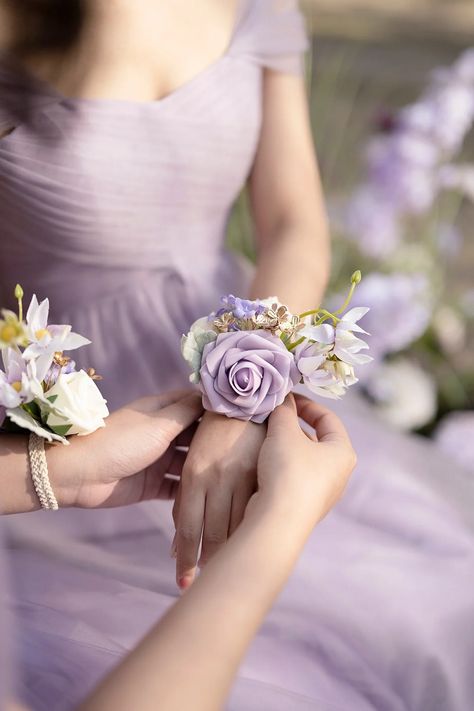 The luxurious wrist corsages are made of artificial Lavender Vendela rose, ivory and cream petite rose, Blushing bride flower, and lavender Hydrangea accented with Willow Dusty Miller, golden leaves. #wrist_corsage #corsage_bracelet #corsage_wristbands #wedding_accessories Bridal Corsages Mothers, Flower Bracelet Wedding Wrist Corsage, Lilac Corsage, Lavender Corsage, Corsage Wedding Mother, Blushing Bride Flower, Corsages For Wedding, Purple Corsage, Vendela Rose